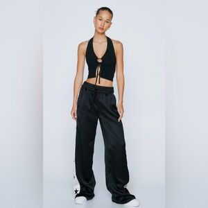 Nasty Gal Black Satin Pants with embroidered star, size 4